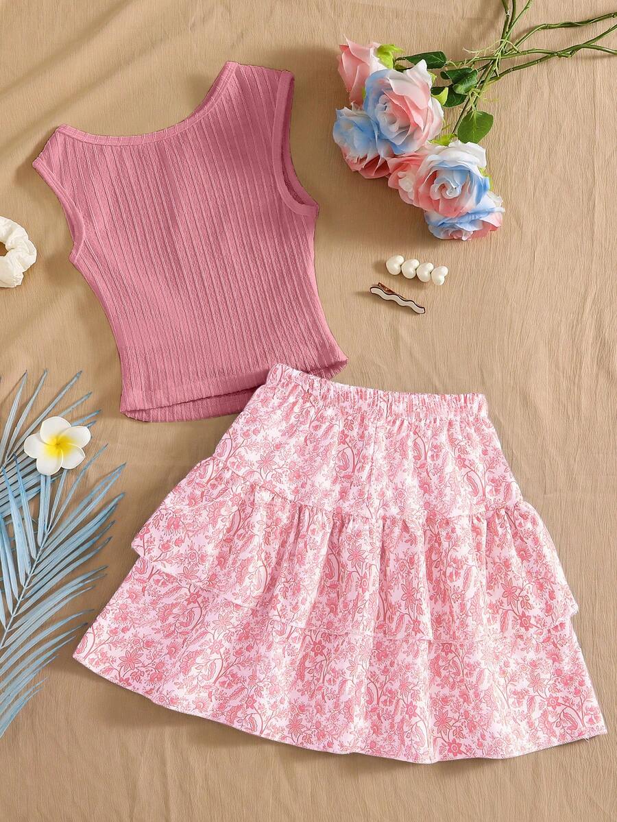 Light blue two-piece outfit set for tween girls with a sleeveless round neck vest top and a tiered ruffle cake skirt featuring a plant pattern.