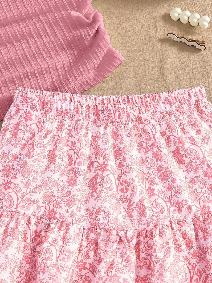 Light blue two-piece outfit set for tween girls with a sleeveless round neck vest top and a tiered ruffle cake skirt featuring a plant pattern.