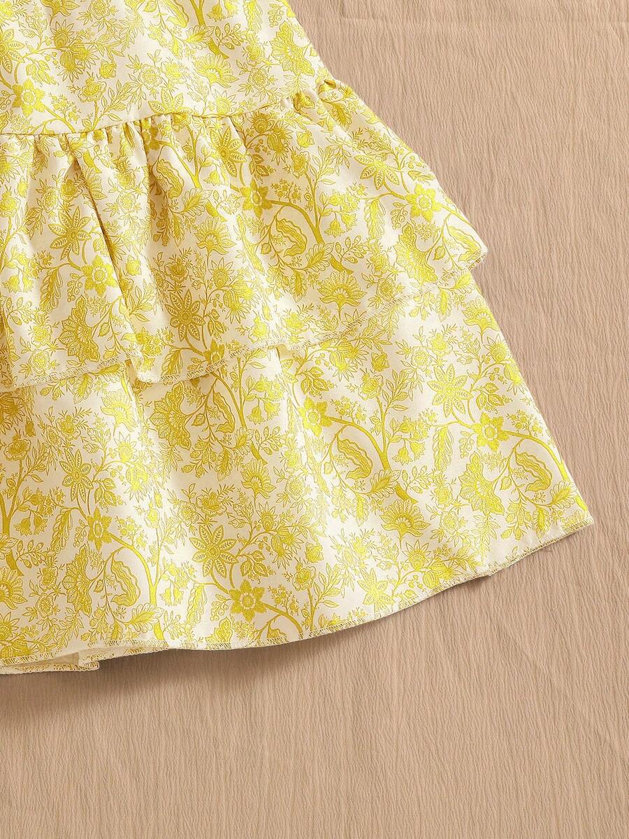 Light blue two-piece outfit set for tween girls with a sleeveless round neck vest top and a tiered ruffle cake skirt featuring a plant pattern.