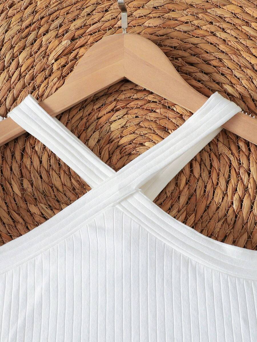 Tween girls blue and white 2-piece set with a striped halter neck vest top and a floral high-waist tiered paperbag skirt.
