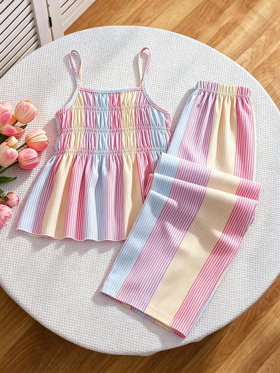 Girls 2-piece summer outfit set featuring a blue bow print camisole top with spaghetti straps and matching high-waisted straight leg pants.