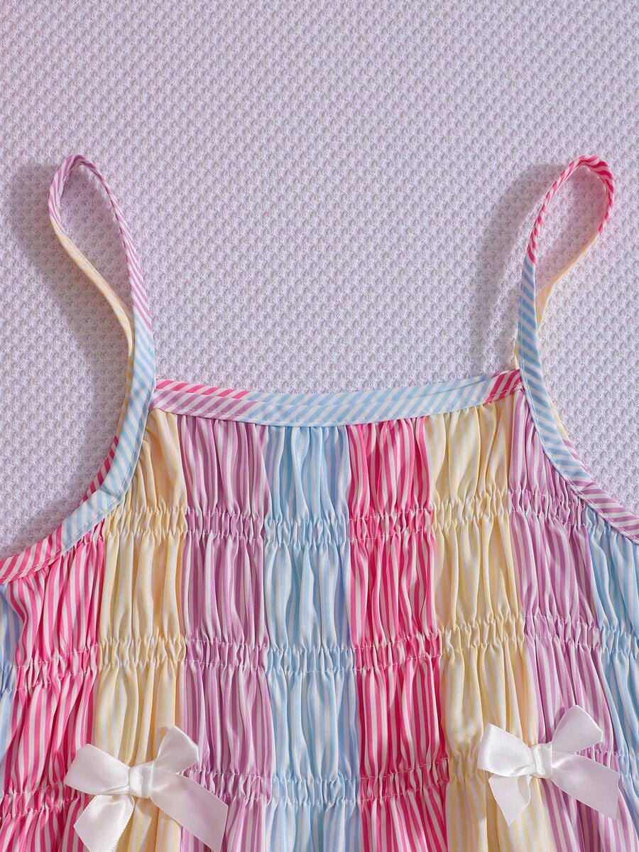 Girls 2-piece summer outfit set featuring a blue bow print camisole top with spaghetti straps and matching high-waisted straight leg pants.