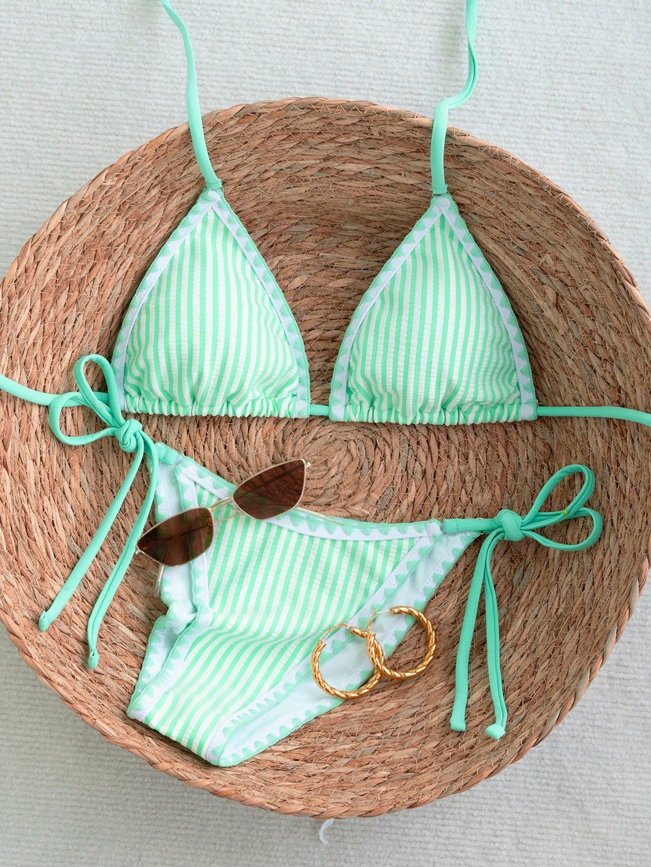 Women's triangle bikini set with contrast lace wireless bra top and ultra high waist tie side bottoms.