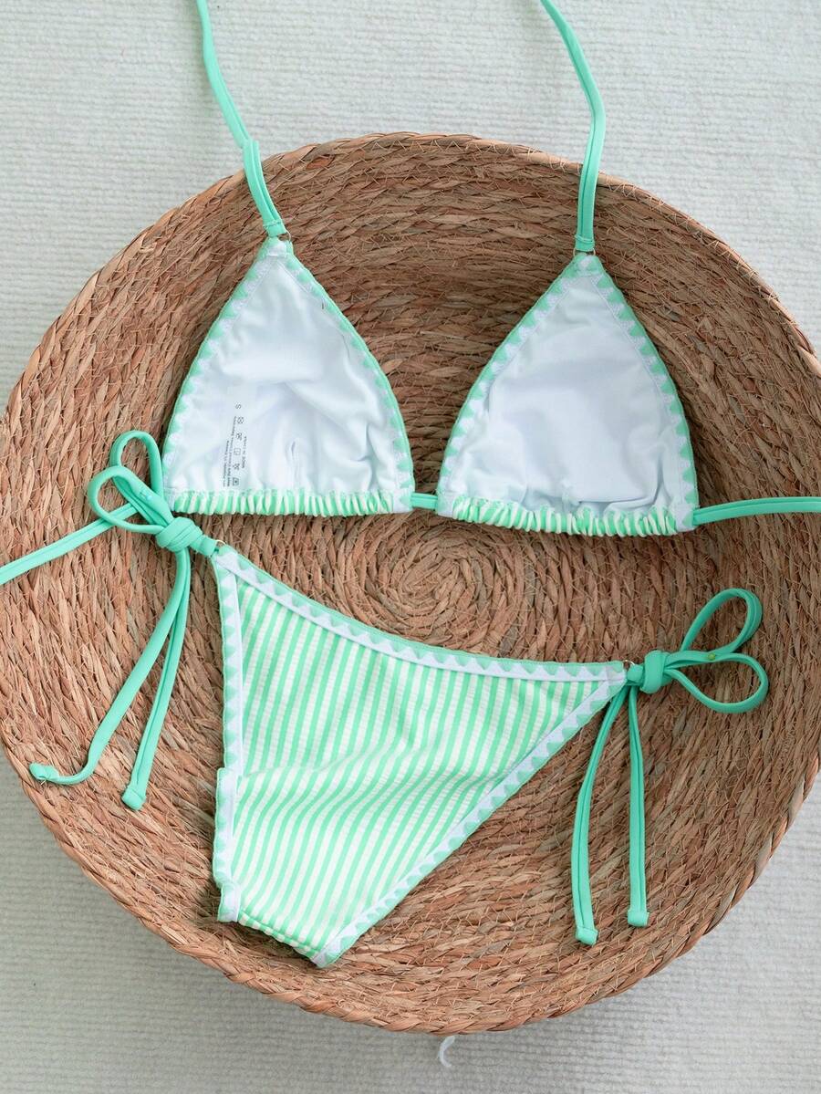 Women's triangle bikini set with contrast lace wireless bra top and ultra high waist tie side bottoms.