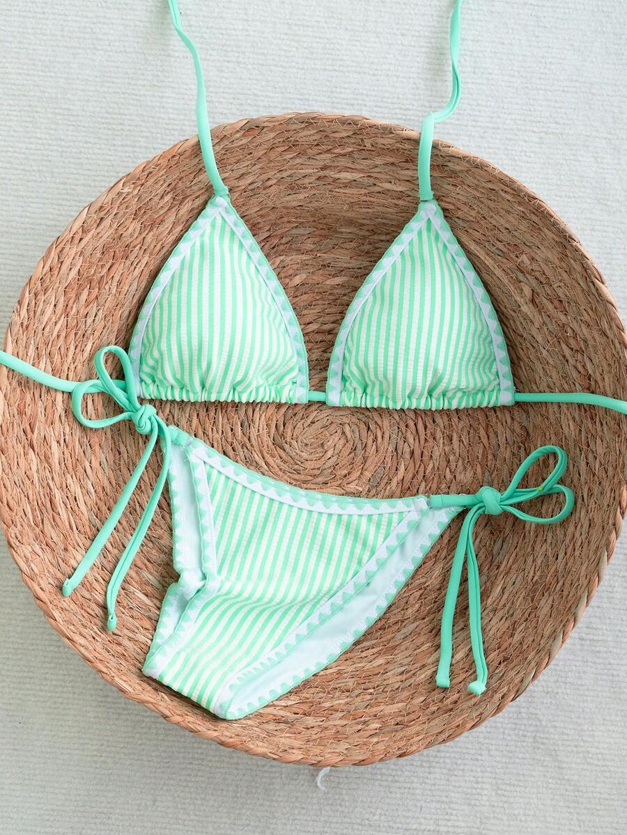 Women's triangle bikini set with contrast lace wireless bra top and ultra high waist tie side bottoms.