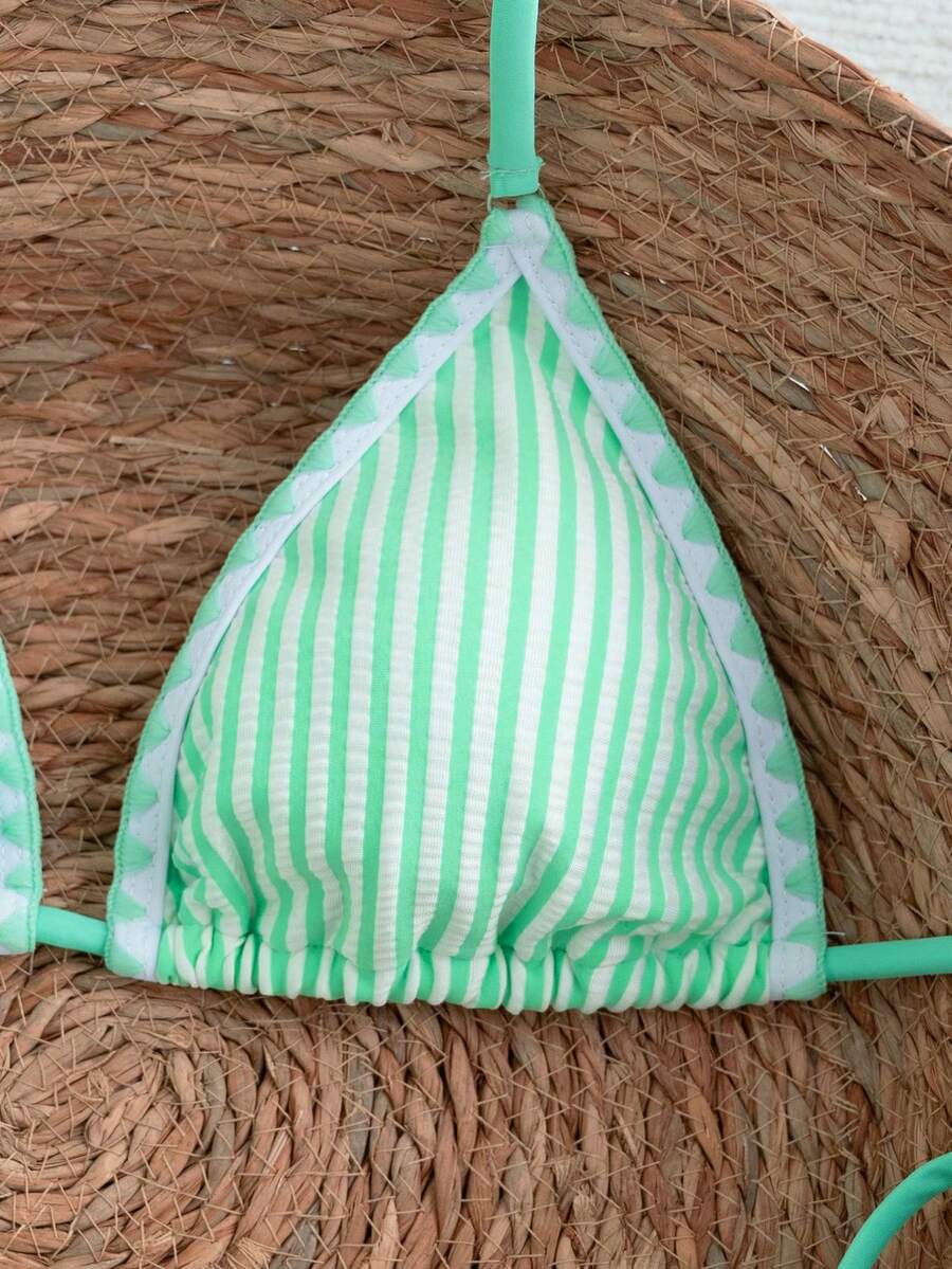 Women's triangle bikini set with contrast lace wireless bra top and ultra high waist tie side bottoms.