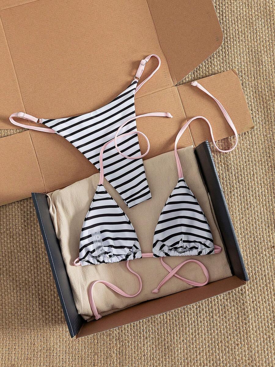 Women's printed halter neck tie two-piece swimwear featuring a wireless triangle top with removable padding and high-waist high-cut bikini bottoms.