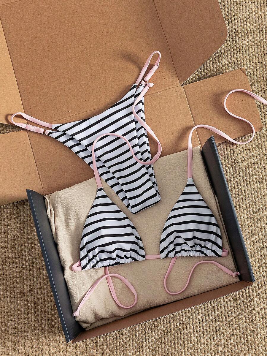 Women's printed halter neck tie two-piece swimwear featuring a wireless triangle top with removable padding and high-waist high-cut bikini bottoms.