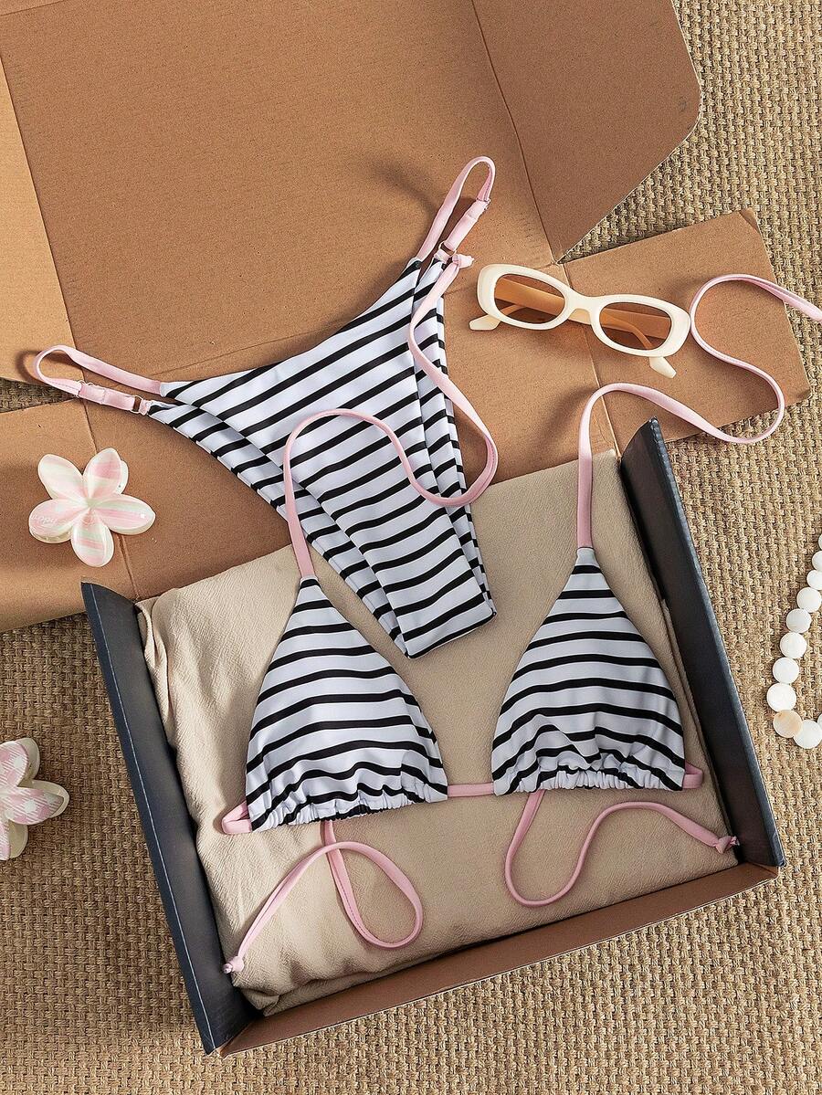 Women's printed halter neck tie two-piece swimwear featuring a wireless triangle top with removable padding and high-waist high-cut bikini bottoms.