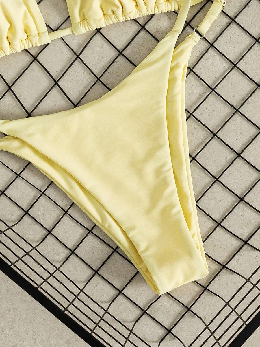 Women's printed halter neck tie two-piece swimwear featuring a wireless triangle top with removable padding and high-waist high-cut bikini bottoms.
