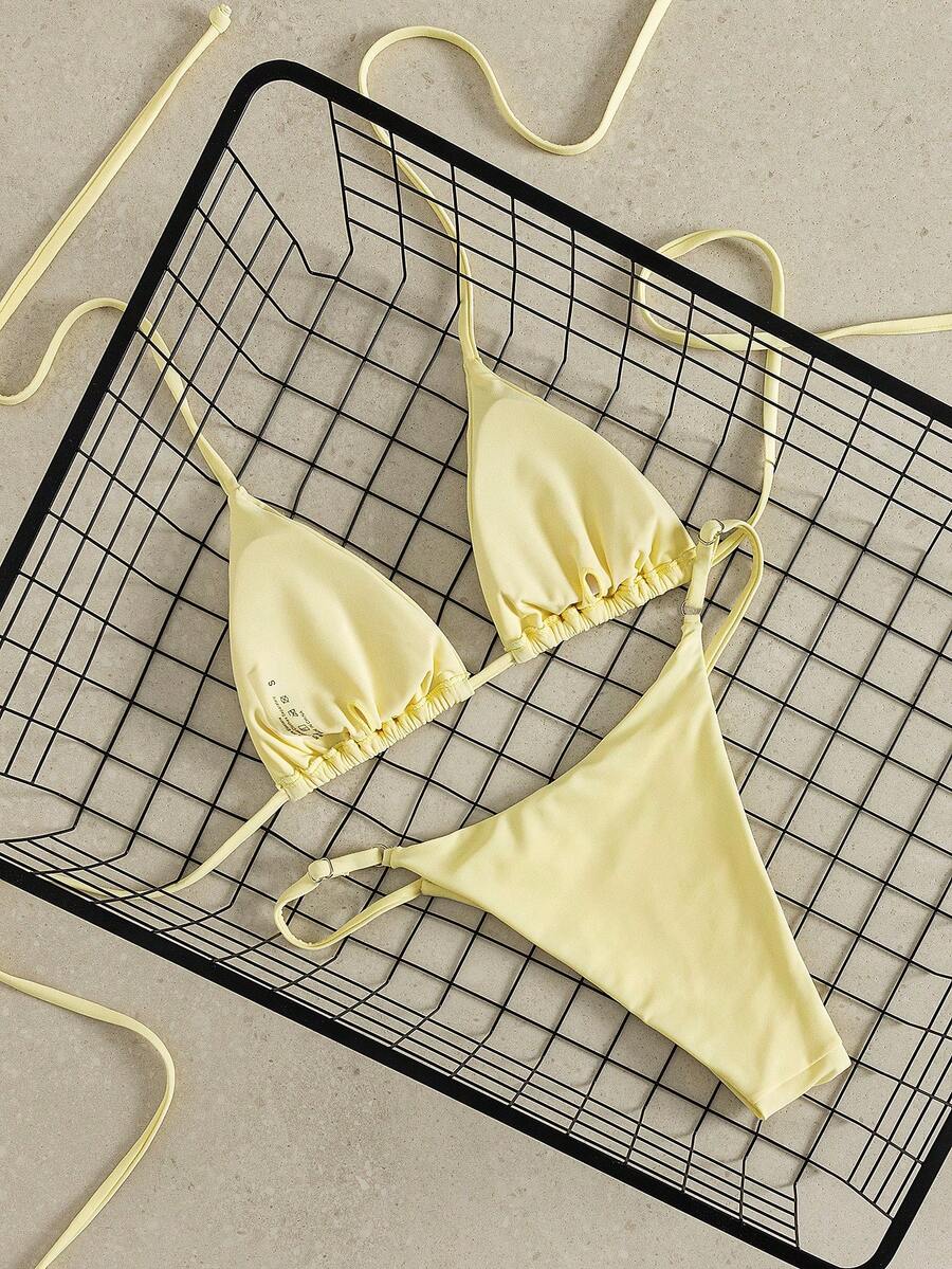 Women's printed halter neck tie two-piece swimwear featuring a wireless triangle top with removable padding and high-waist high-cut bikini bottoms.
