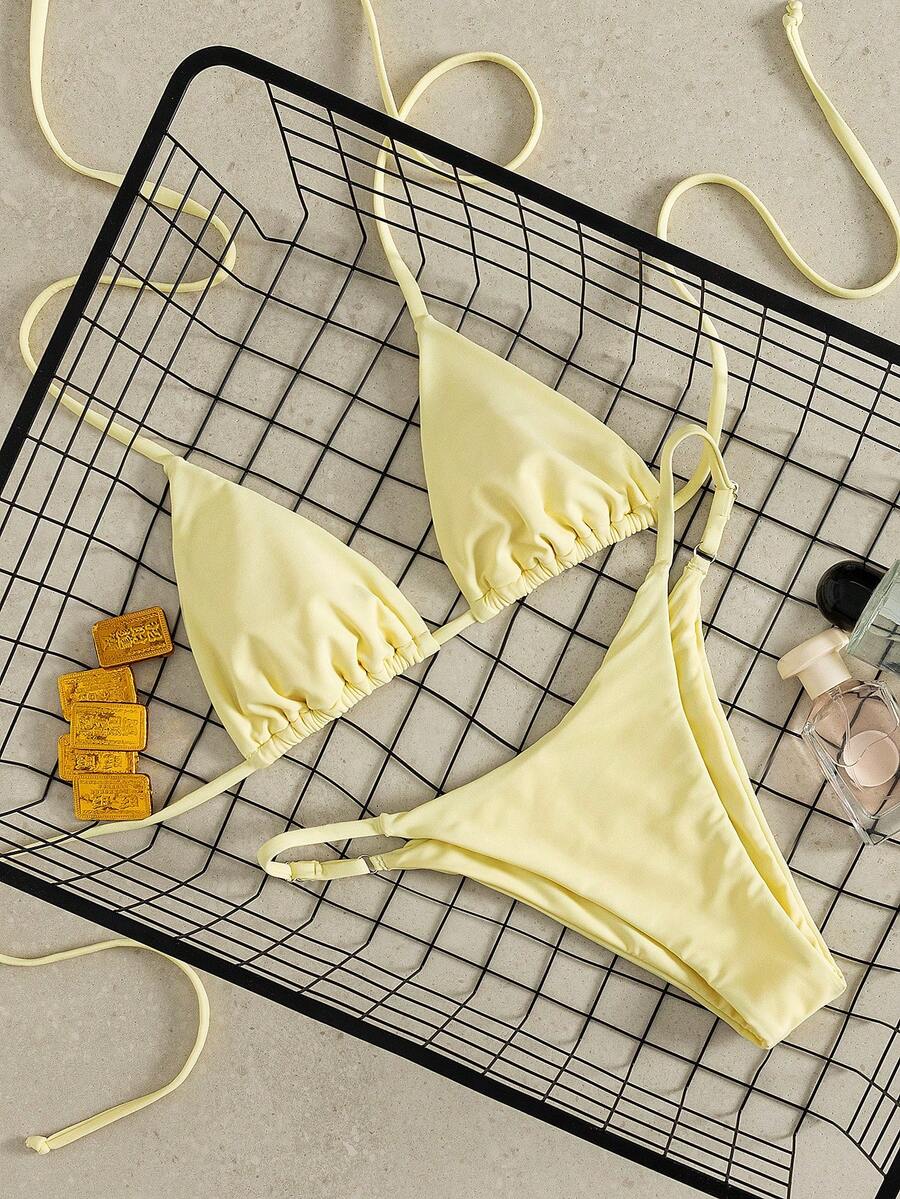 Women's printed halter neck tie two-piece swimwear featuring a wireless triangle top with removable padding and high-waist high-cut bikini bottoms.