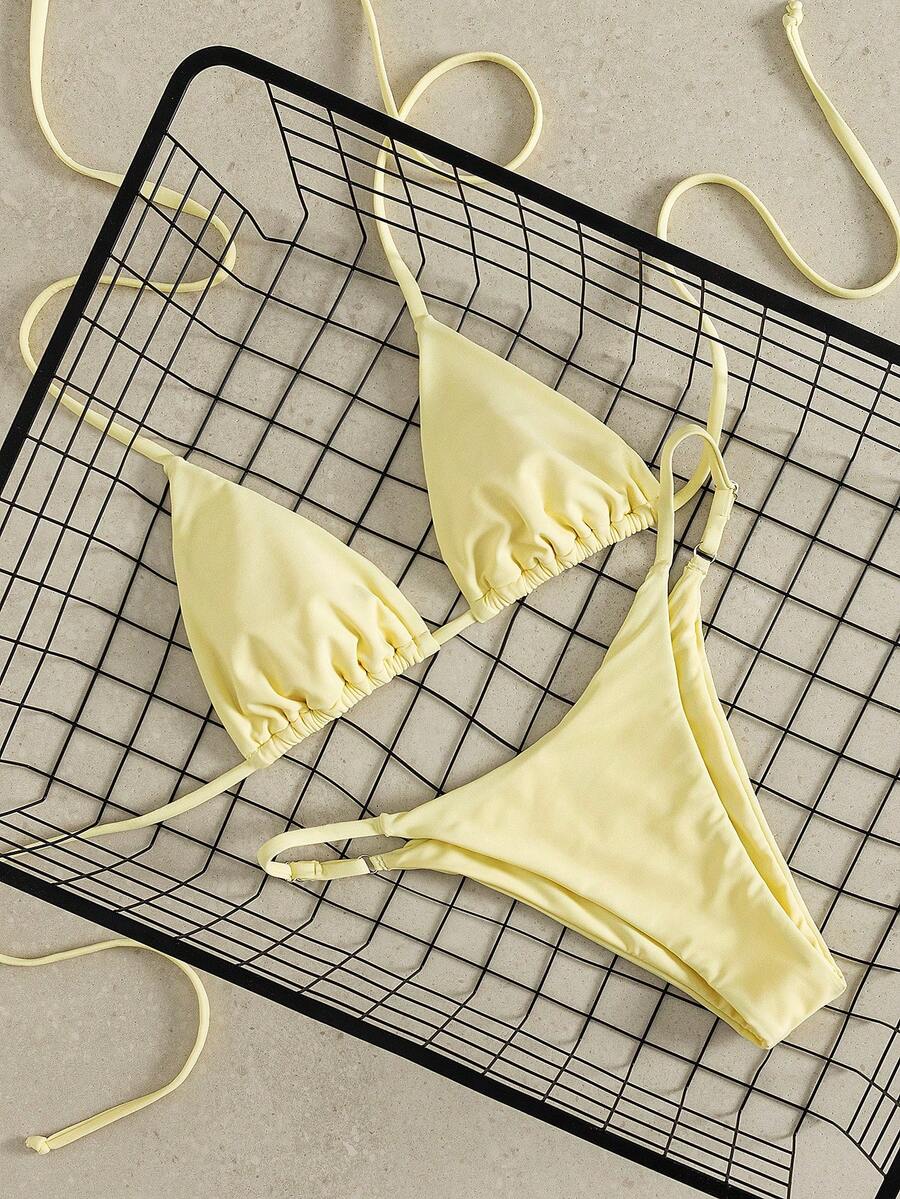 Women's printed halter neck tie two-piece swimwear featuring a wireless triangle top with removable padding and high-waist high-cut bikini bottoms.