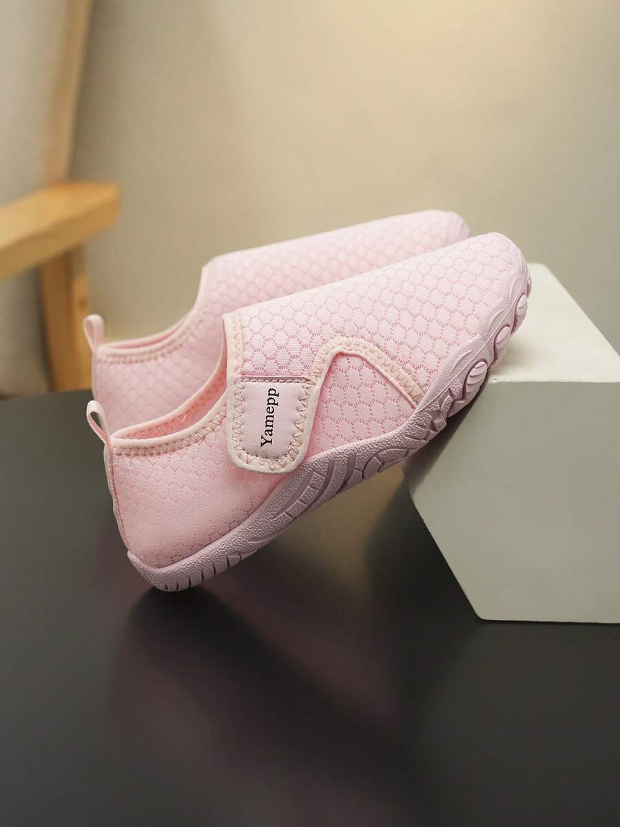 Kids breathable mesh water shoes with hook and loop closure and durable rubber outsole.
