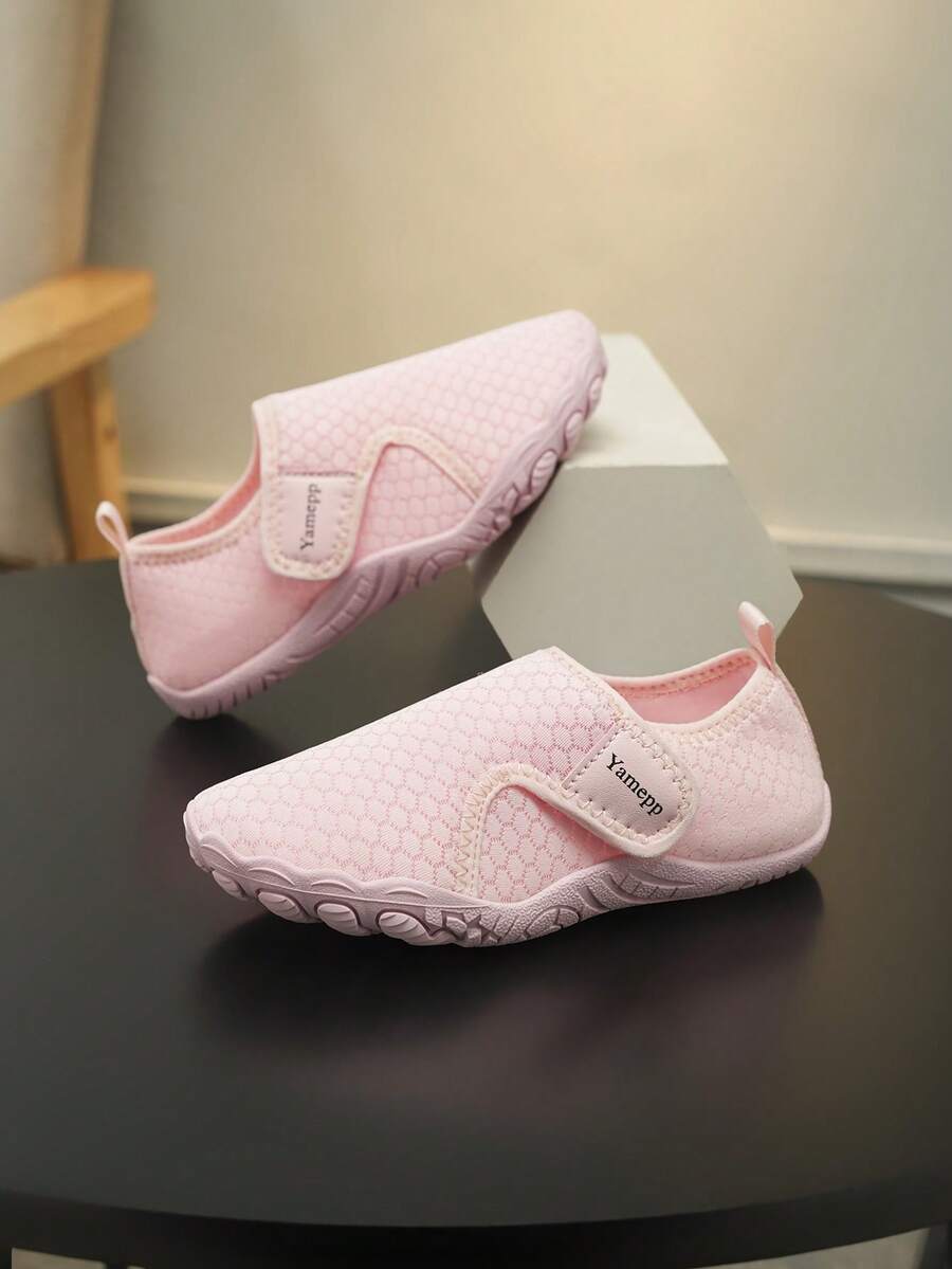 Kids breathable mesh water shoes with hook and loop closure and durable rubber outsole.