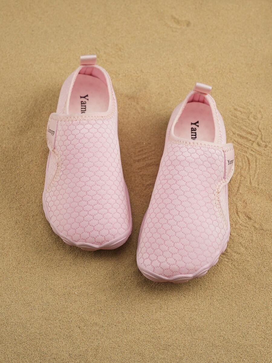 Kids breathable mesh water shoes with hook and loop closure and durable rubber outsole.