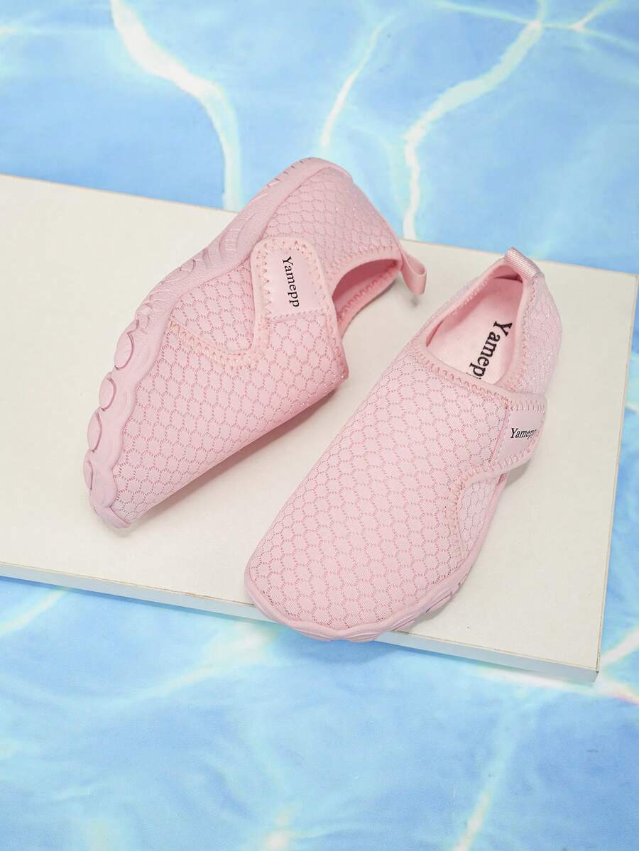 Kids breathable mesh water shoes with hook and loop closure and durable rubber outsole.