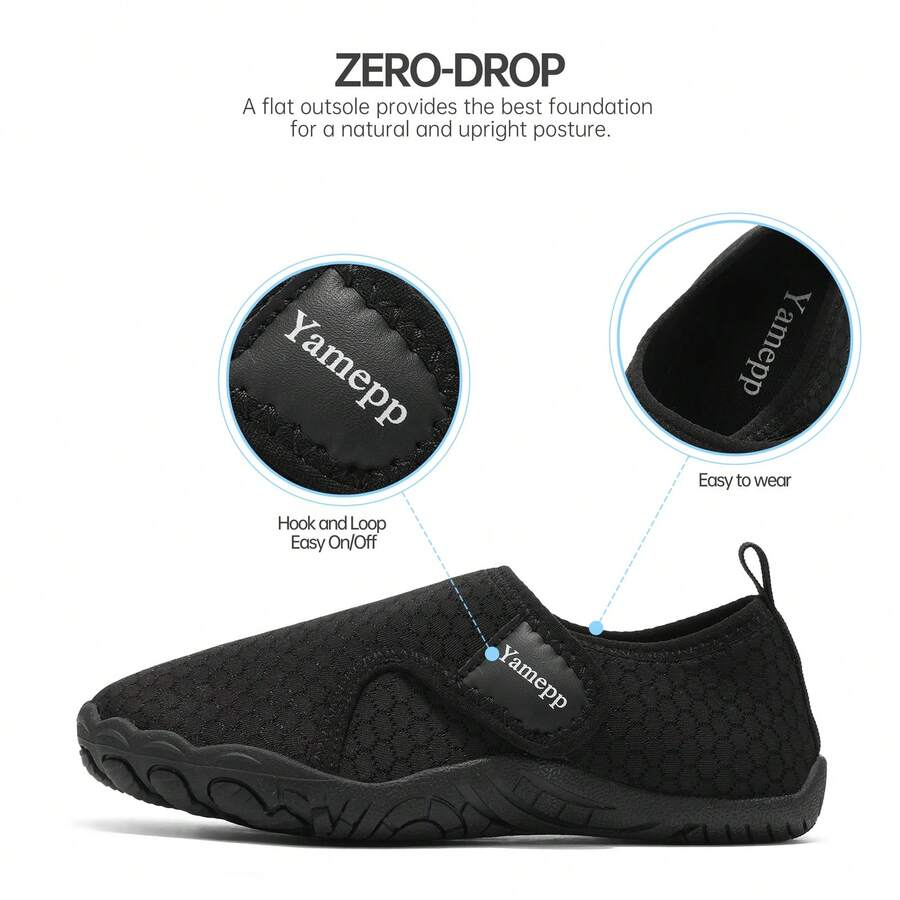Black low-top kids water shoes featuring a breathable fabric upper, hook and loop closure, and rubber outsole for boys and girls.