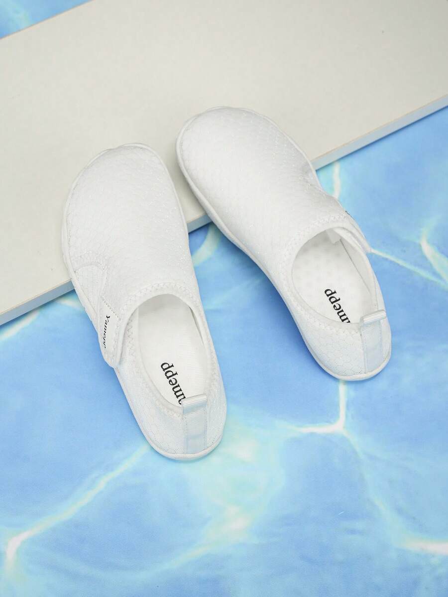 Kids breathable mesh water shoes with hook and loop closure and durable rubber outsole.