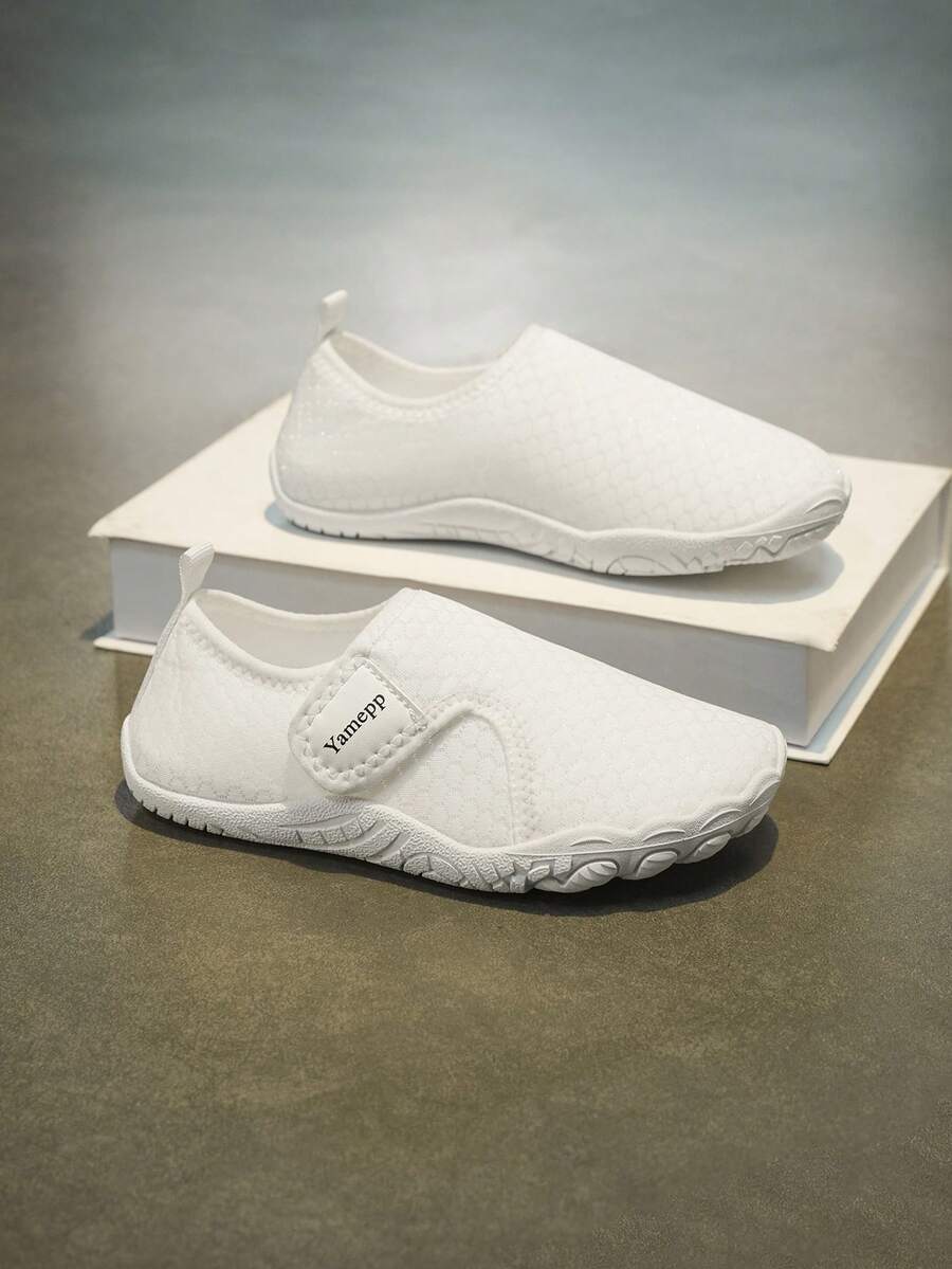 Kids breathable mesh water shoes with hook and loop closure and durable rubber outsole.