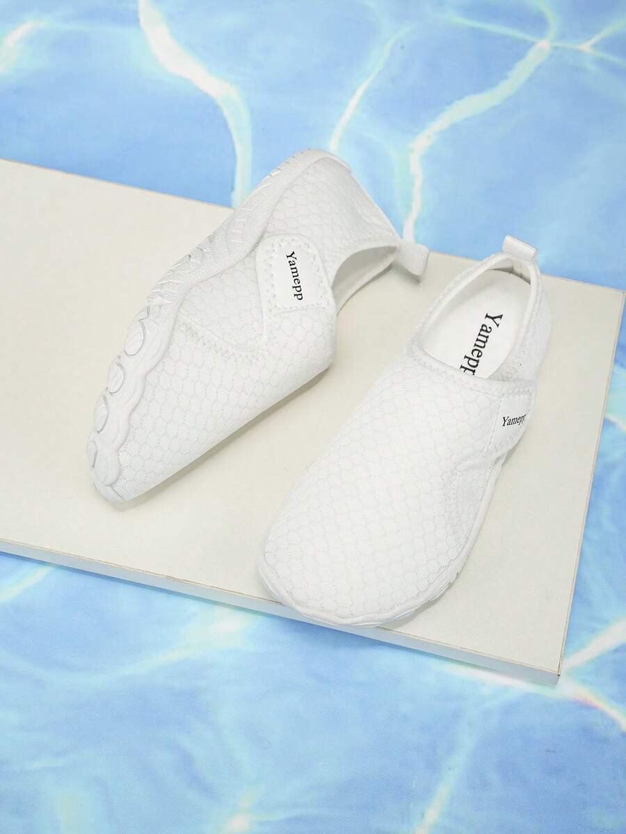 Kids breathable mesh water shoes with hook and loop closure and durable rubber outsole.