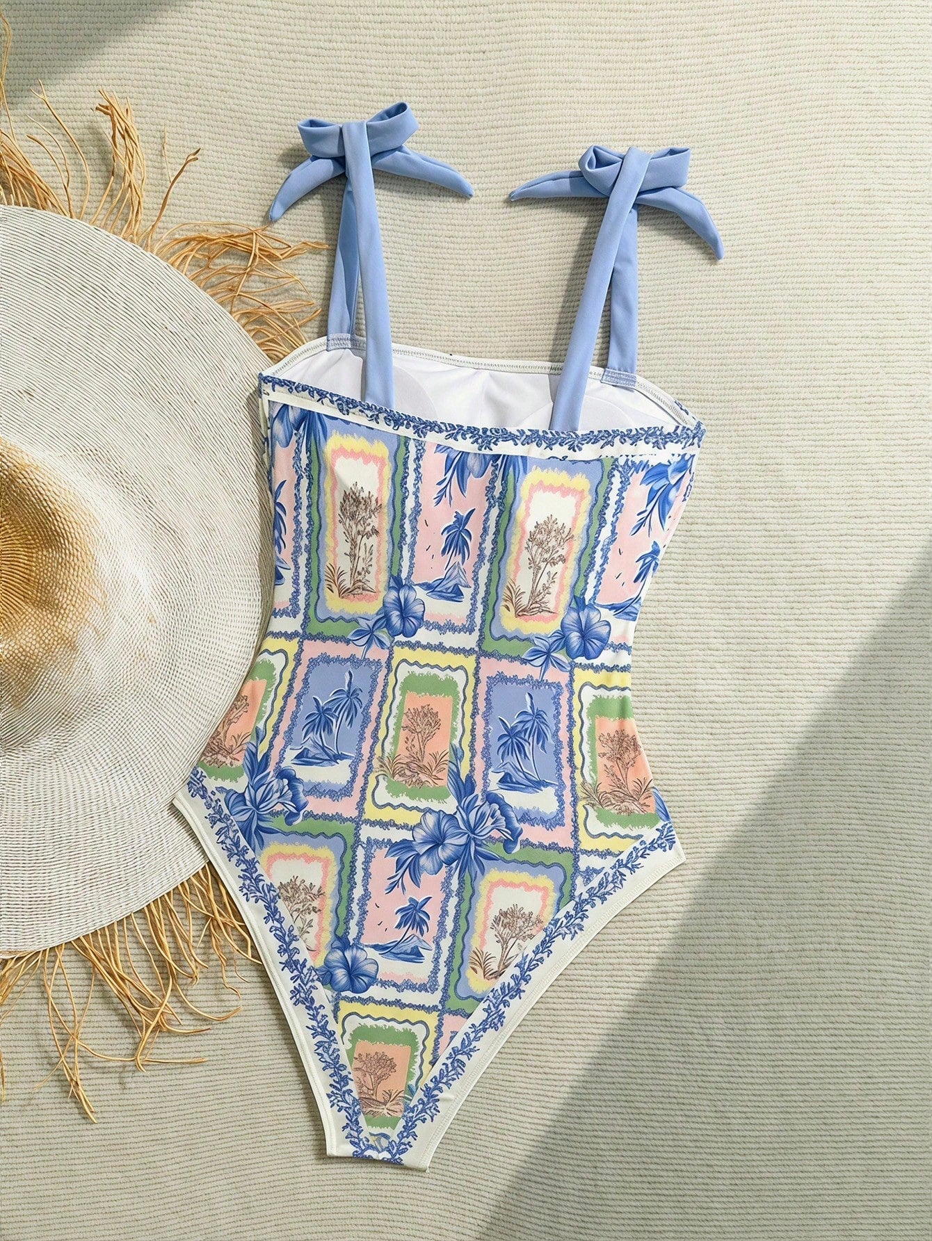 NEWSHEIN tween girls one-piece swimsuit in blue with geometric full print, twist shoulder straps, lined body, and vacation swimwear style.