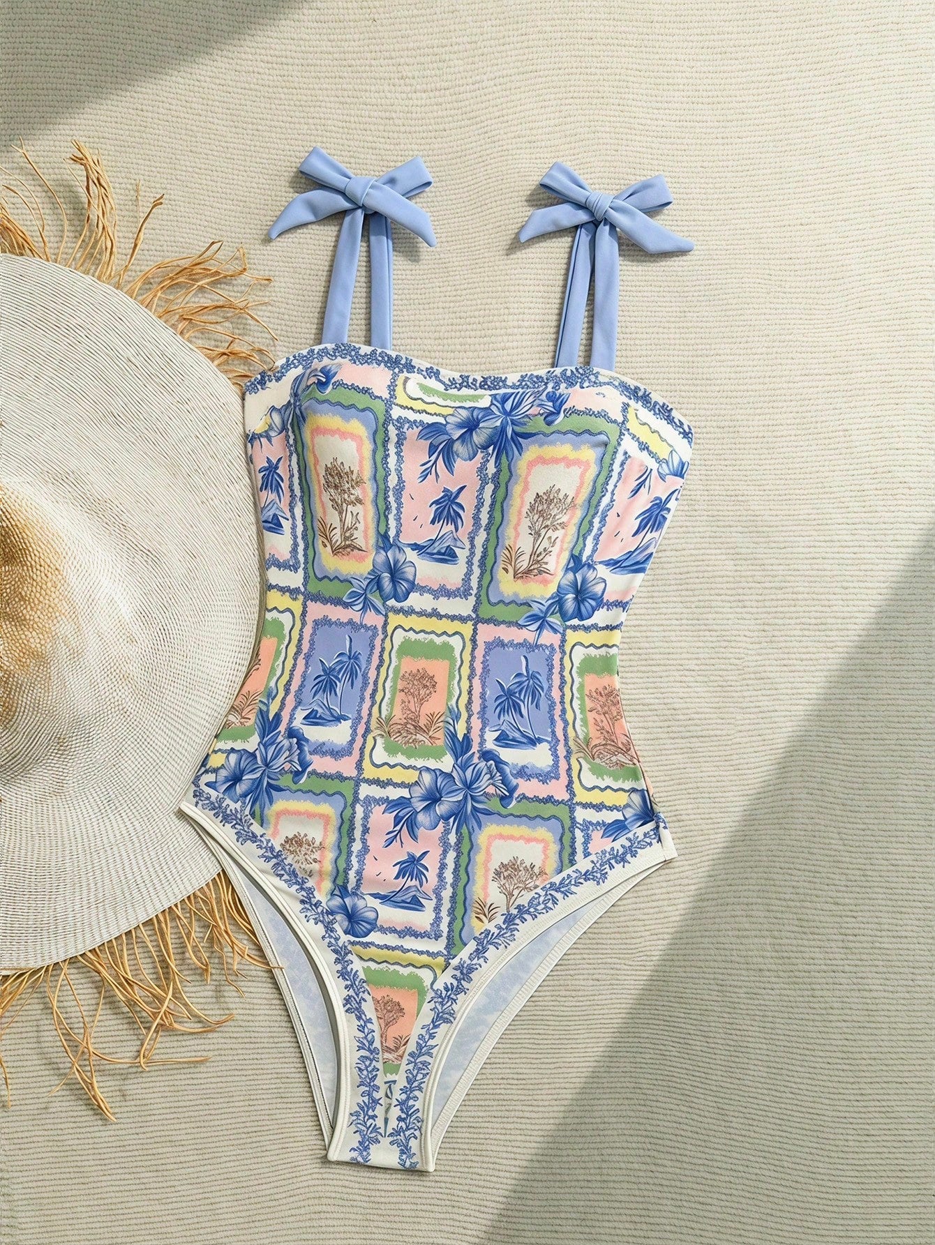 NEWSHEIN tween girls one-piece swimsuit in blue with geometric full print, twist shoulder straps, lined body, and vacation swimwear style.