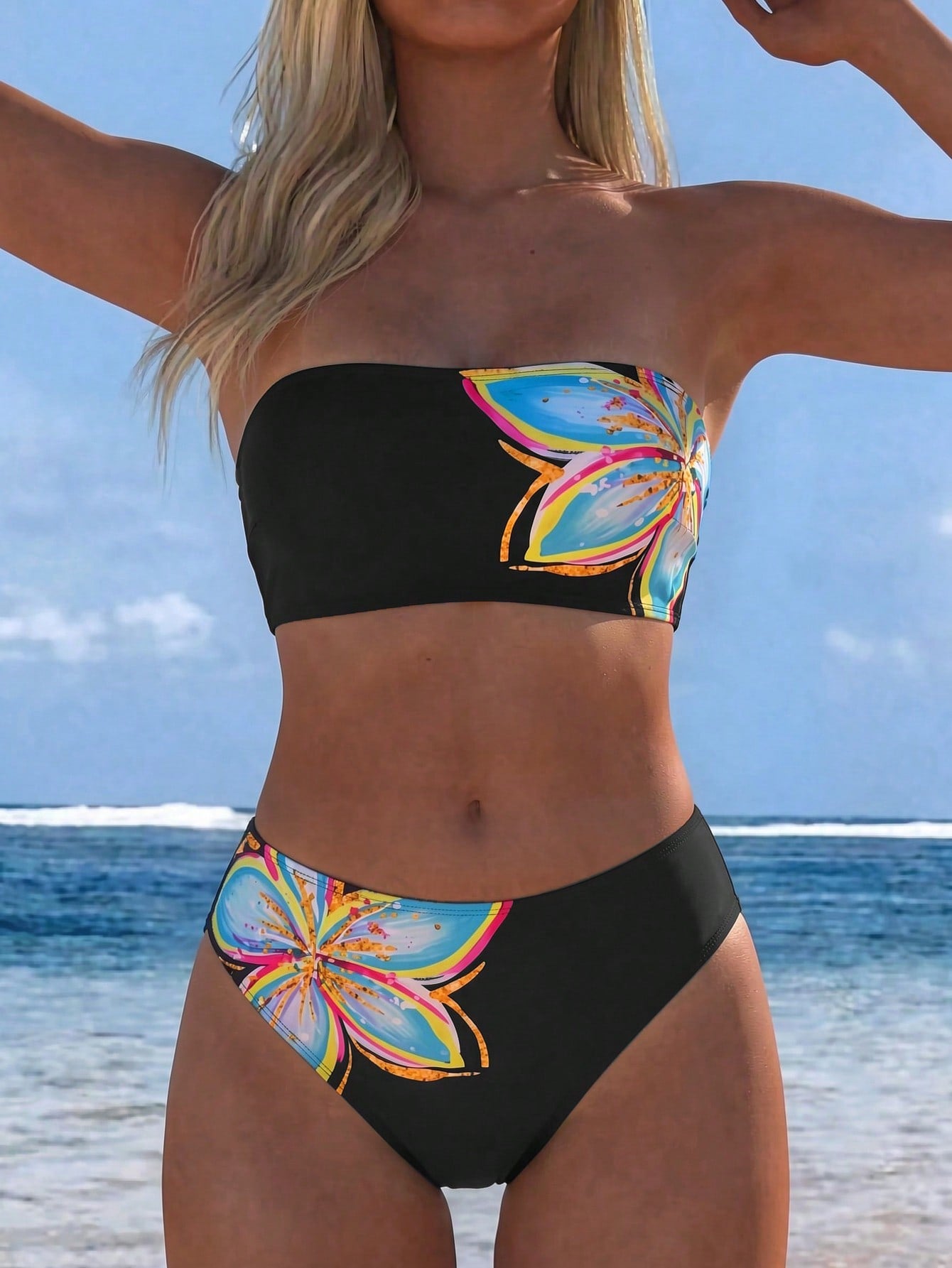Women's black two-piece bandeau bikini set featuring high waist bottoms, backless buckle closure, and removable padding.