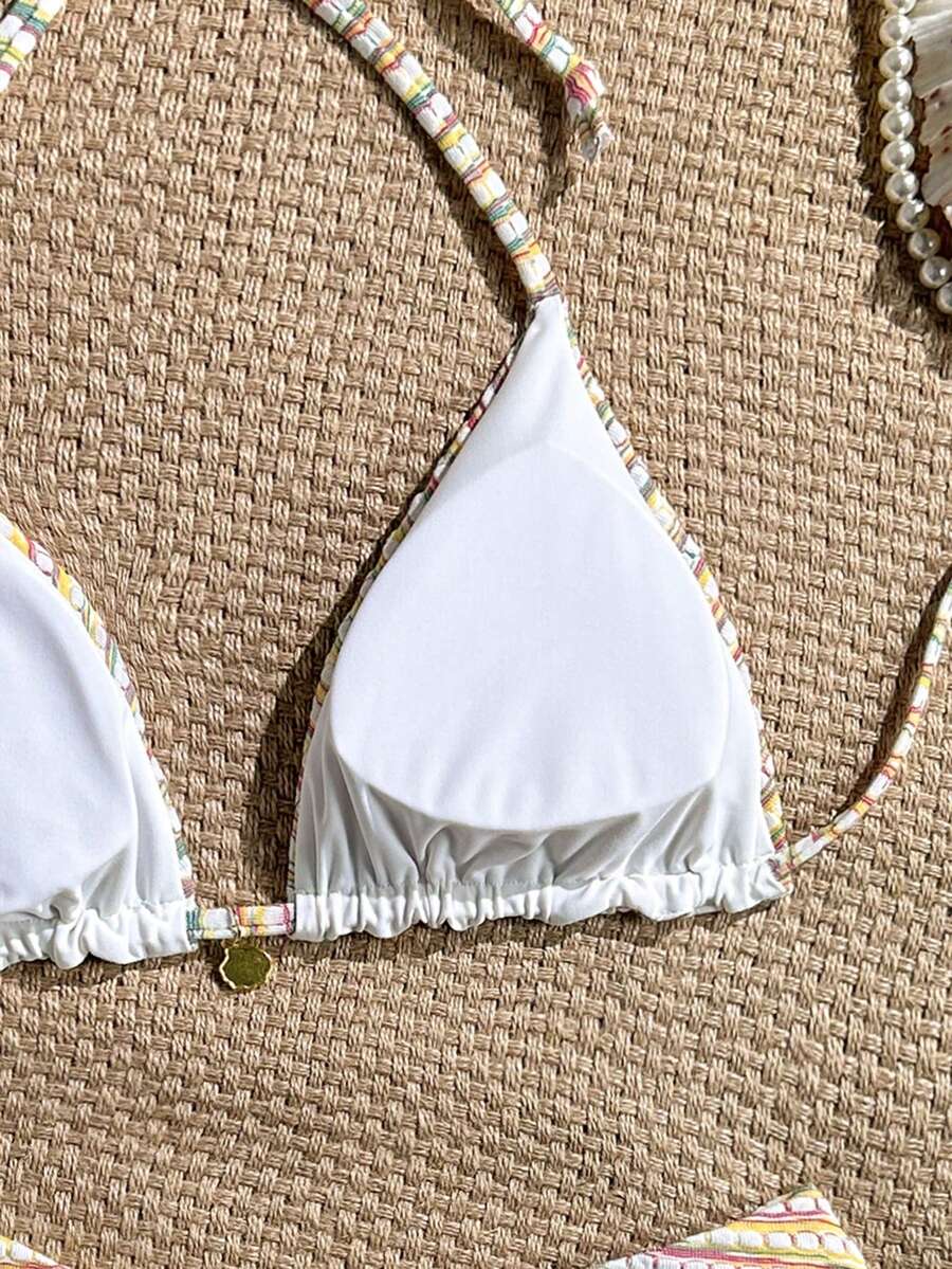 Women's black textured plaid 2-piece bikini set featuring a halter neckline, wireless triangle cups with removable padding, and mid-waist bottoms.
