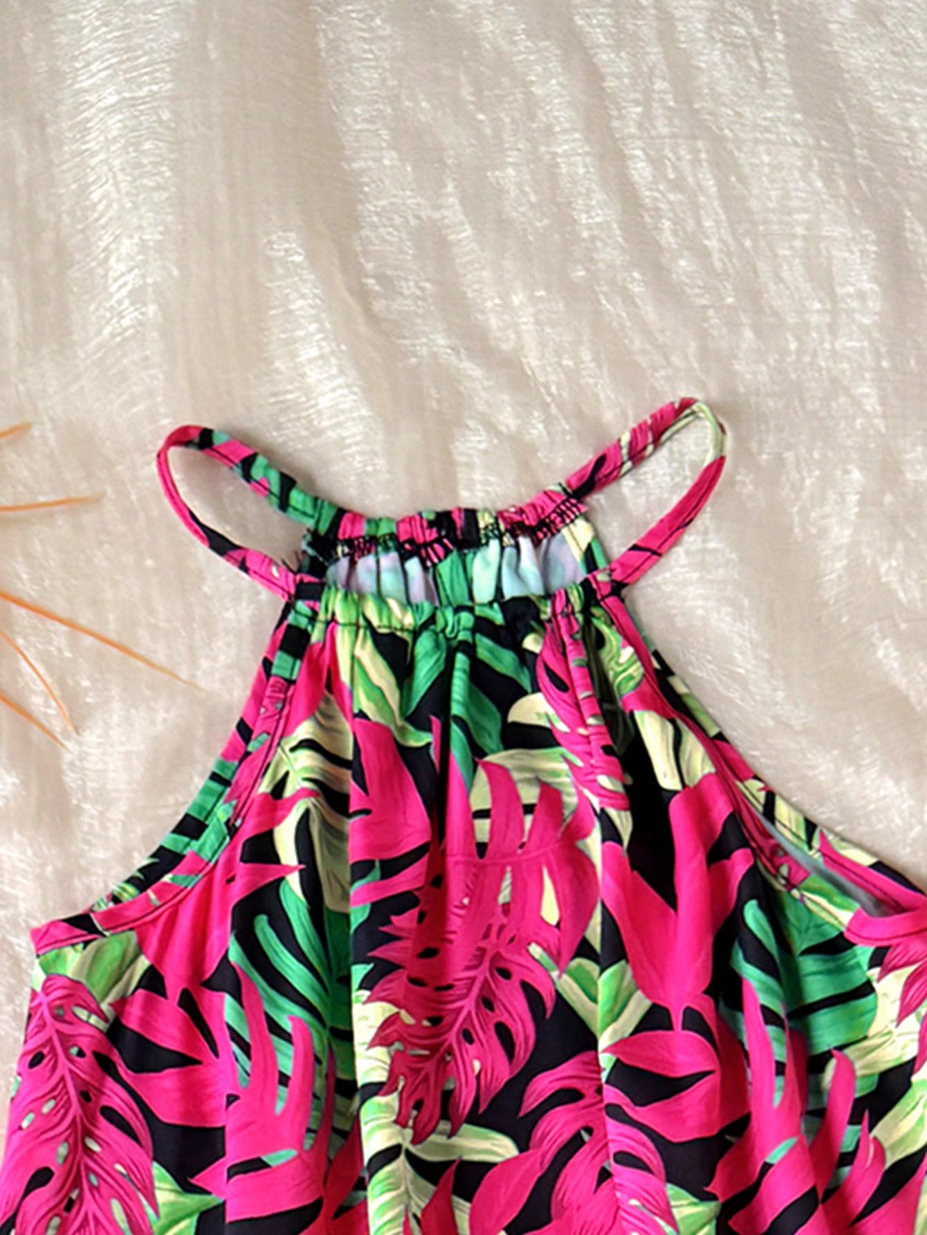 Tween girls floral print dress with halter neckline, sleeveless cold shoulder design, A-line shape, and vacation style.