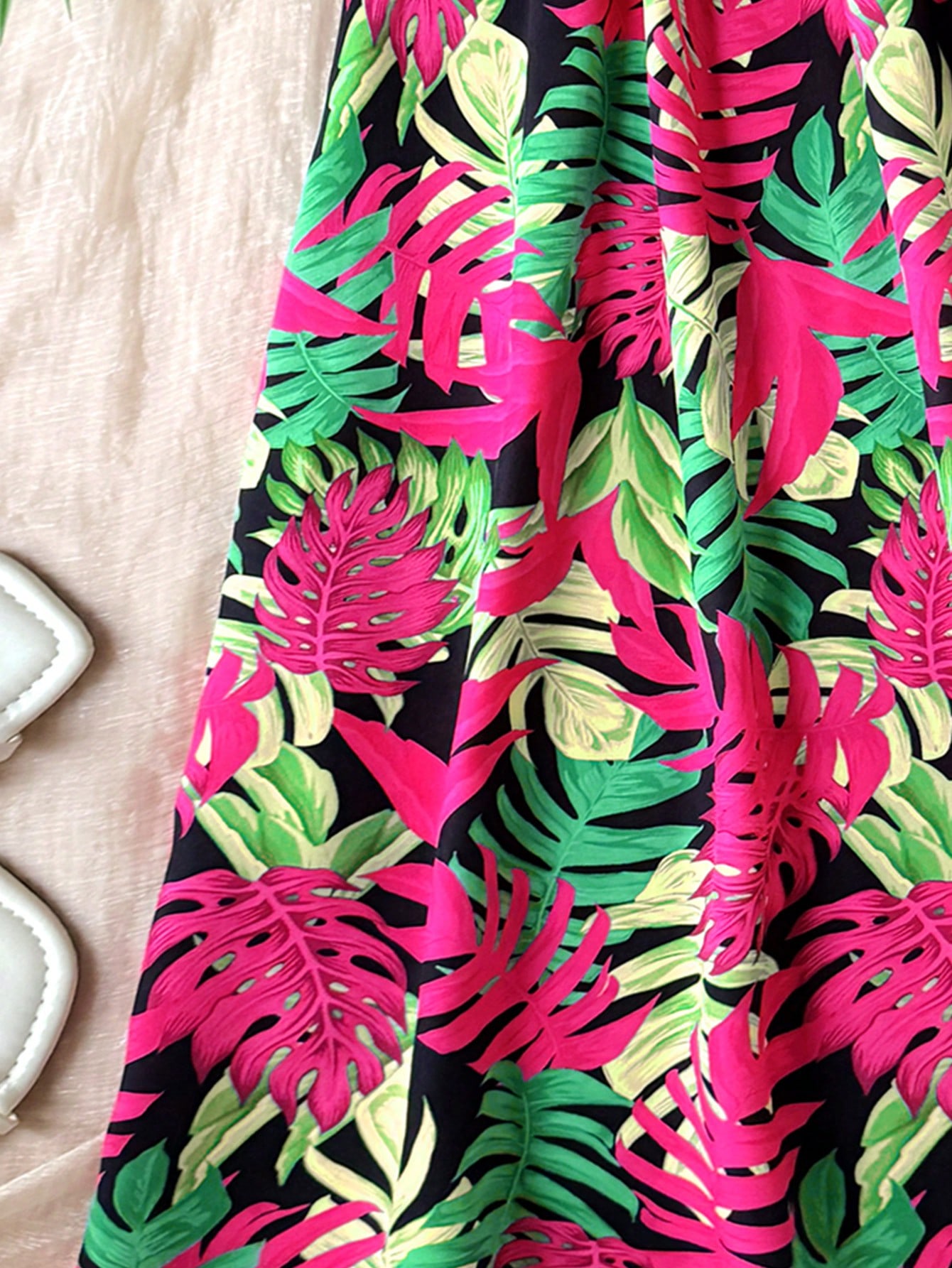 Tween girls floral print dress with halter neckline, sleeveless cold shoulder design, A-line shape, and vacation style.
