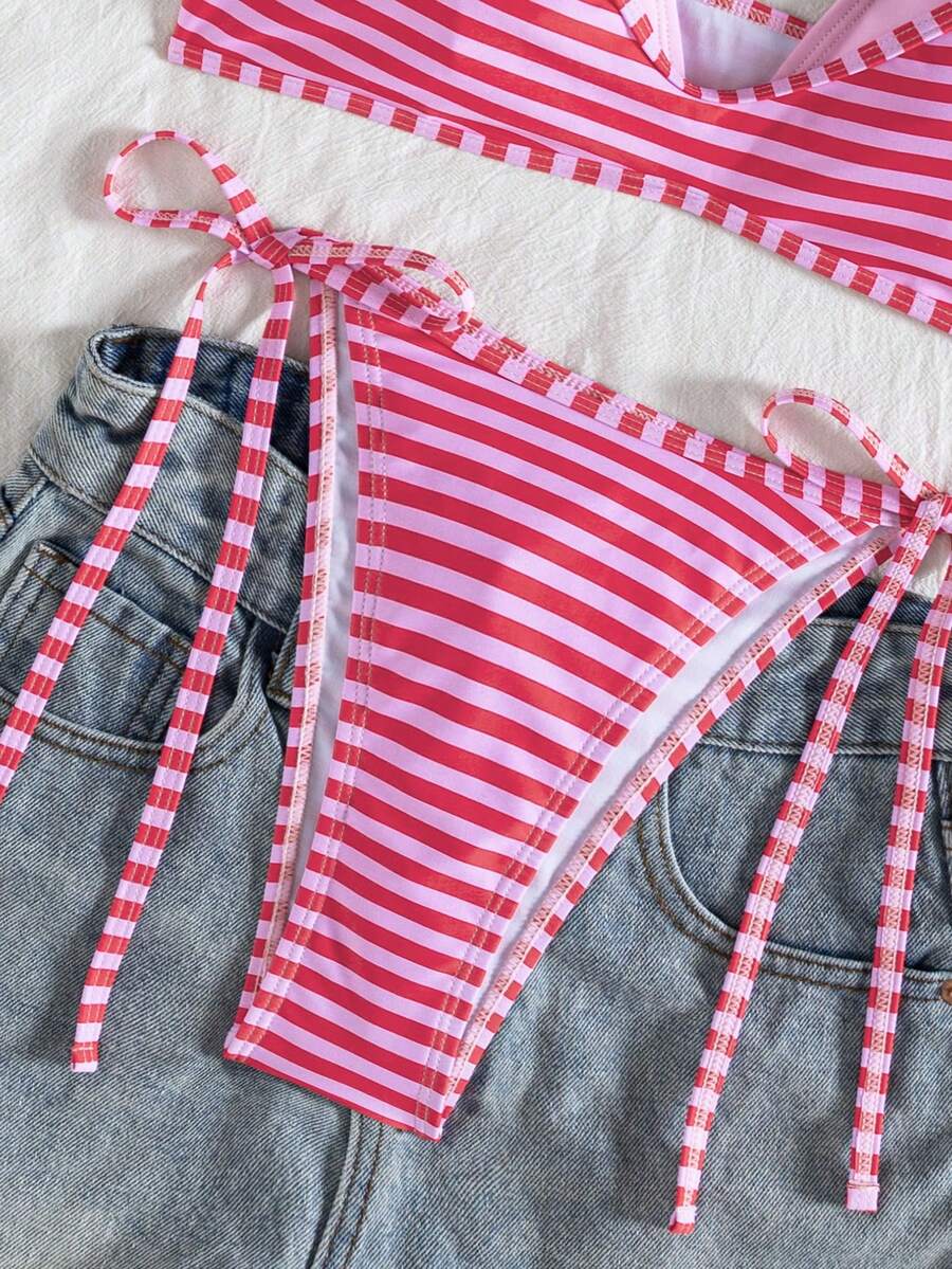 Women's color-block two-piece bikini set featuring a boho geometric pattern, tie-back halter top with removable padding, and matching tie-side bikini bottoms.