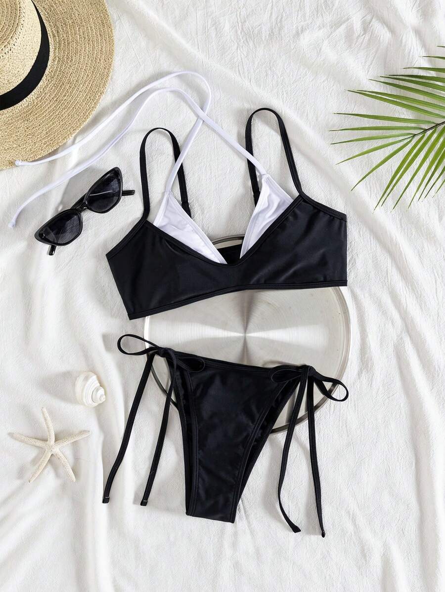Women's color-block two-piece bikini set featuring a boho geometric pattern, tie-back halter top with removable padding, and matching tie-side bikini bottoms.
