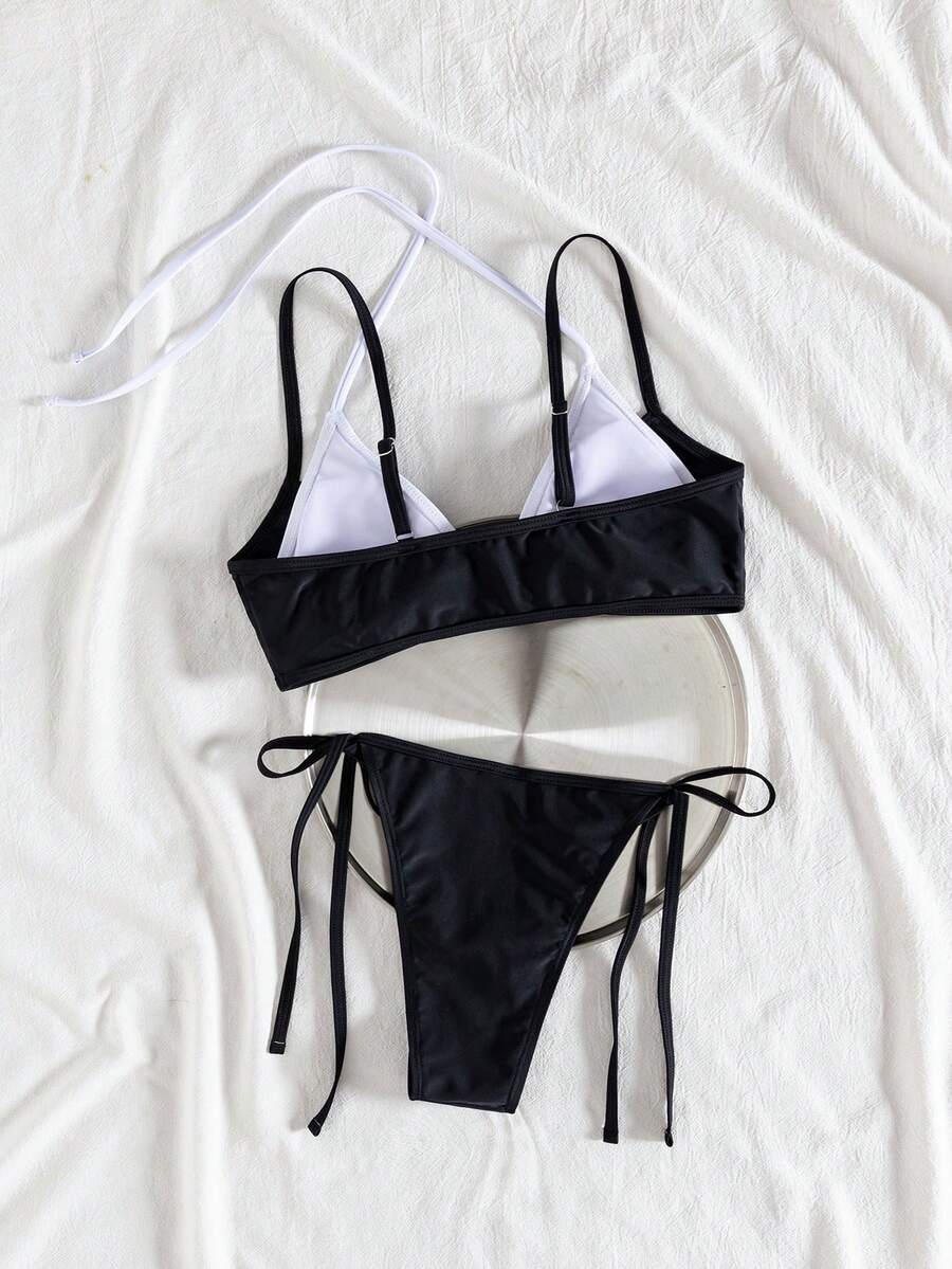 Women's color-block two-piece bikini set featuring a boho geometric pattern, tie-back halter top with removable padding, and matching tie-side bikini bottoms.