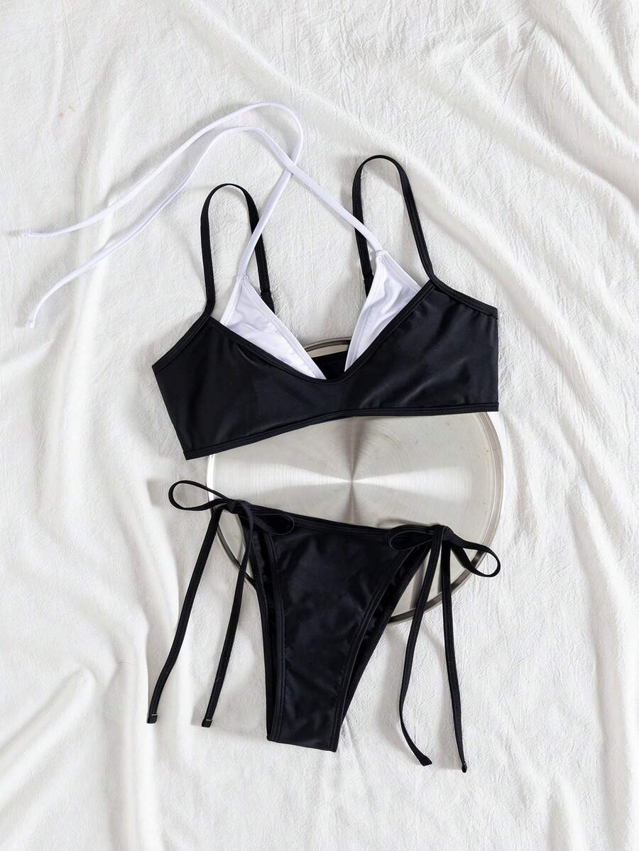 Women's color-block two-piece bikini set featuring a boho geometric pattern, tie-back halter top with removable padding, and matching tie-side bikini bottoms.