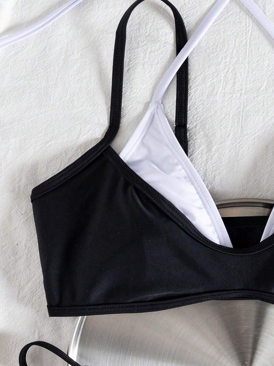 Women's color-block two-piece bikini set featuring a boho geometric pattern, tie-back halter top with removable padding, and matching tie-side bikini bottoms.