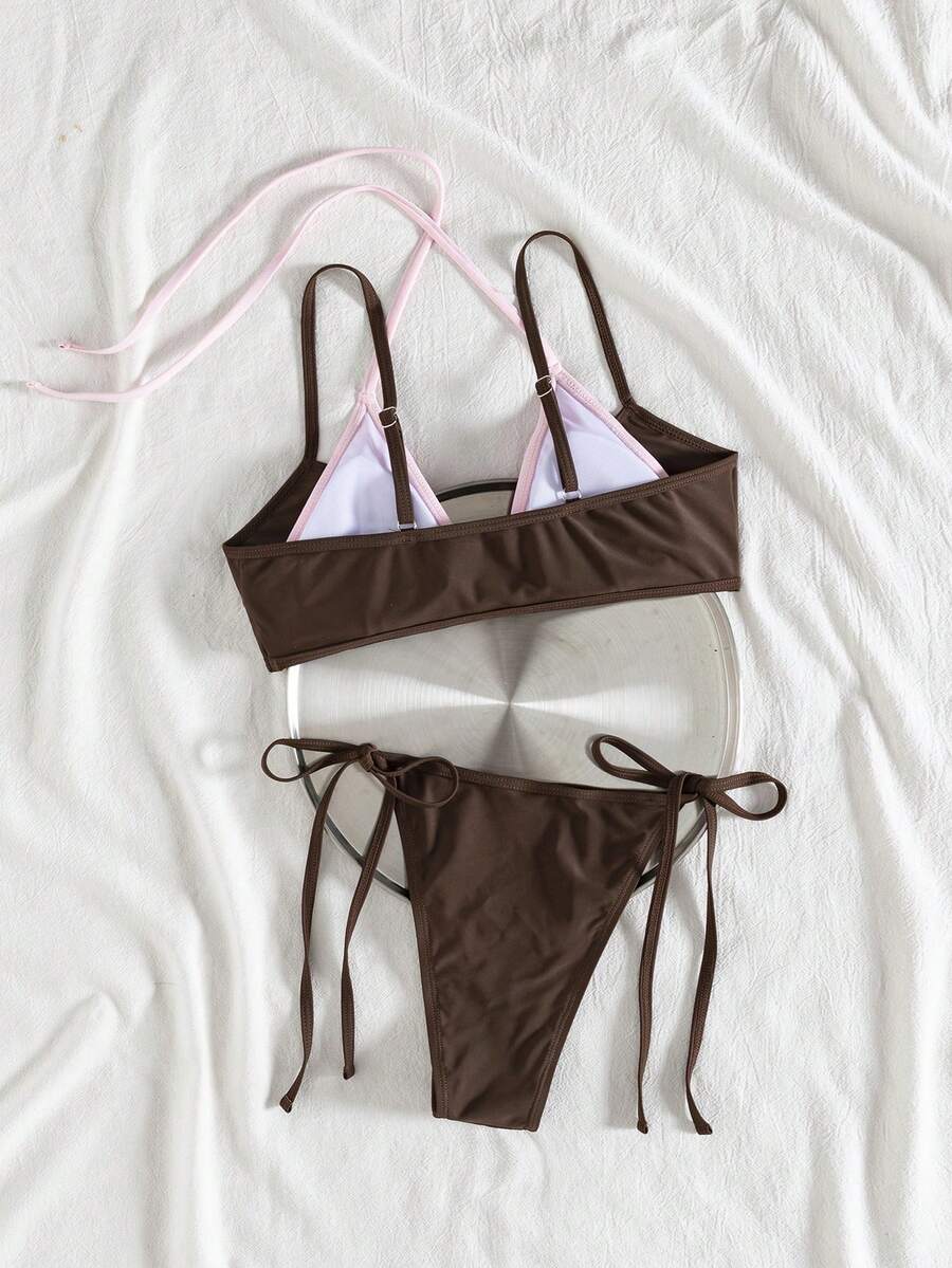 Women's color-block two-piece bikini set featuring a boho geometric pattern, tie-back halter top with removable padding, and matching tie-side bikini bottoms.