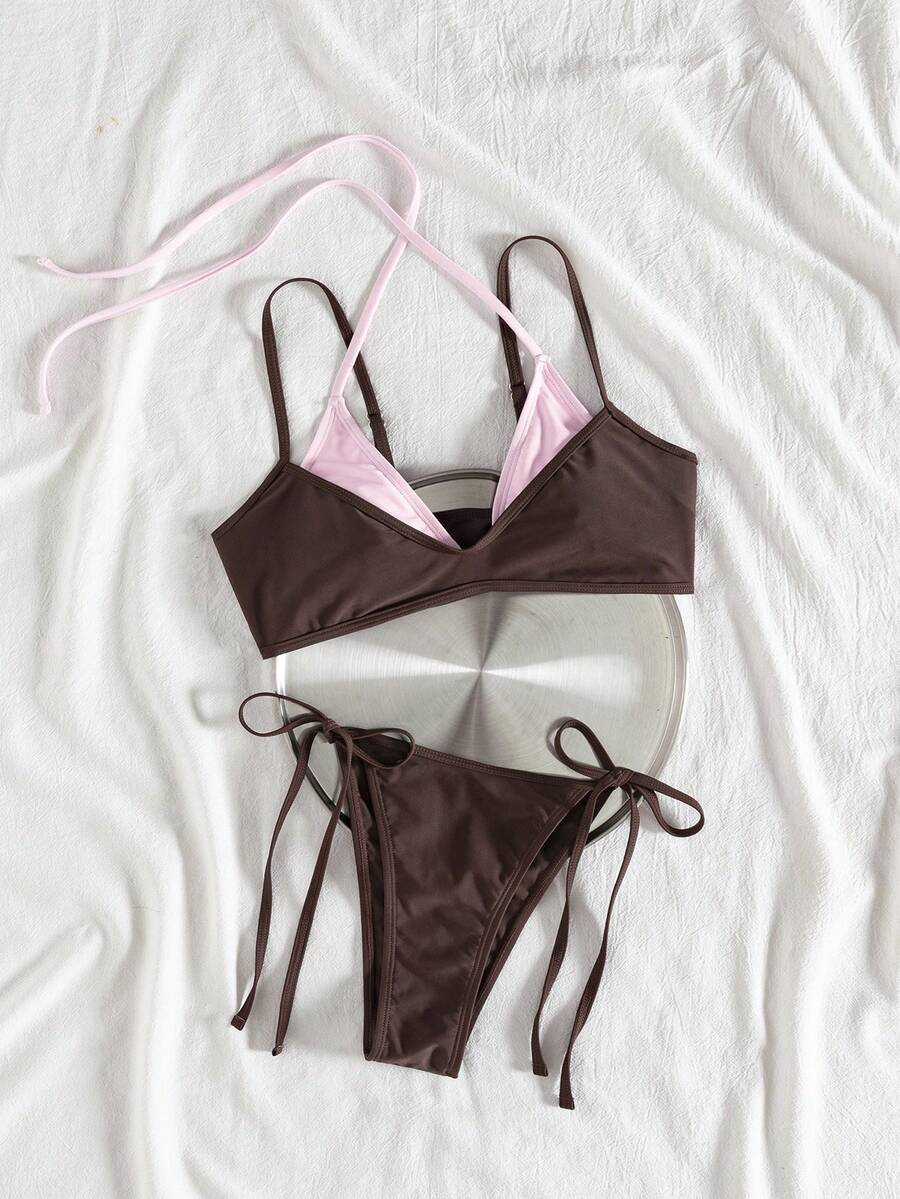 Women's color-block two-piece bikini set featuring a boho geometric pattern, tie-back halter top with removable padding, and matching tie-side bikini bottoms.