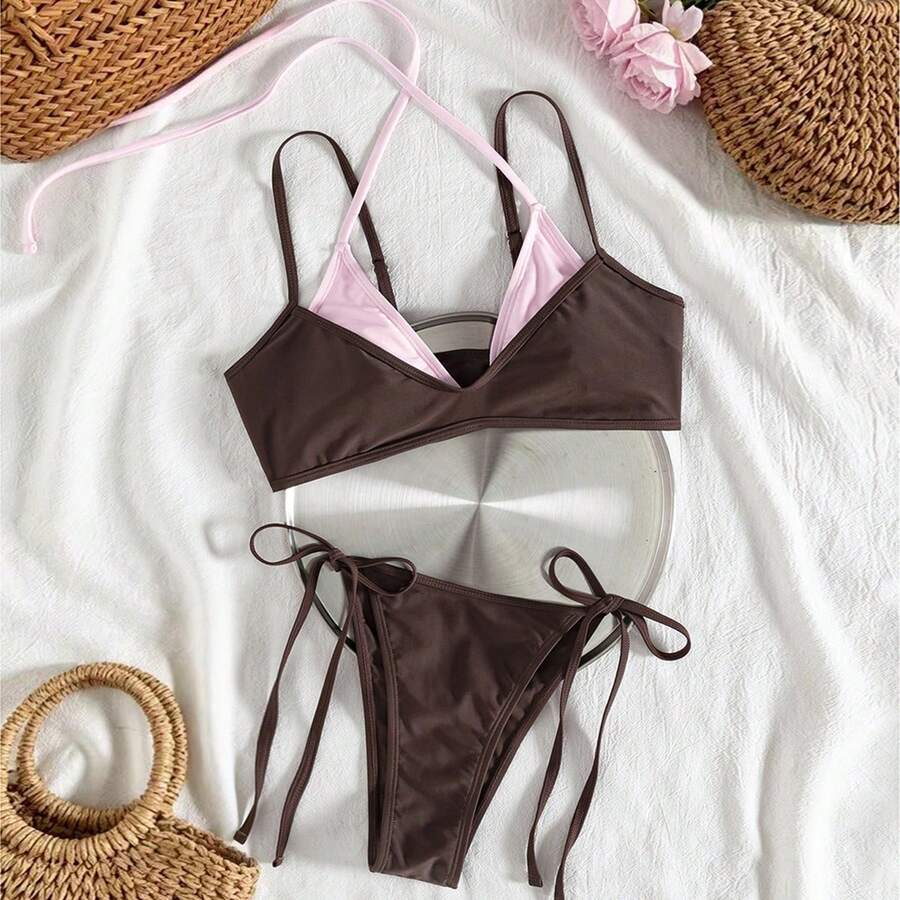 Women's color-block two-piece bikini set featuring a boho geometric pattern, tie-back halter top with removable padding, and matching tie-side bikini bottoms.