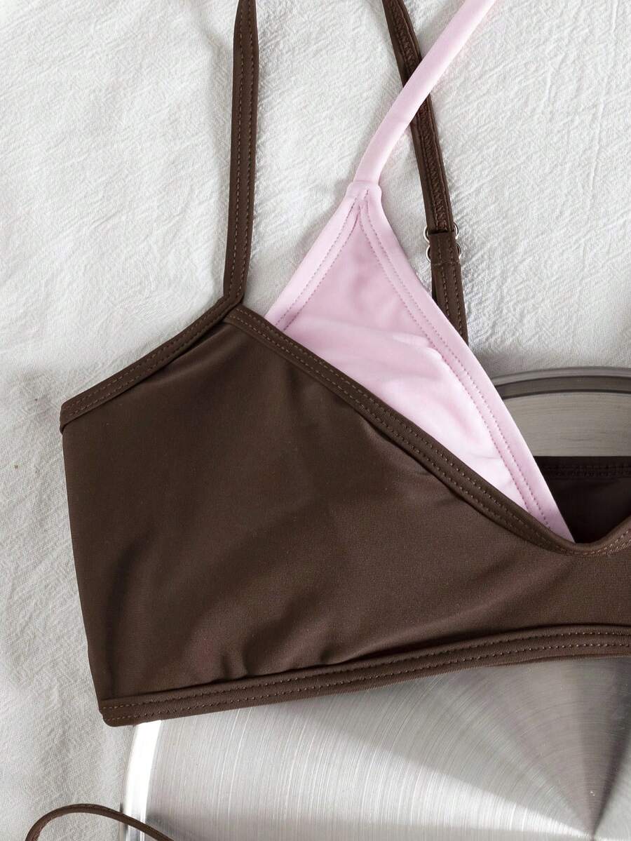 Women's color-block two-piece bikini set featuring a boho geometric pattern, tie-back halter top with removable padding, and matching tie-side bikini bottoms.