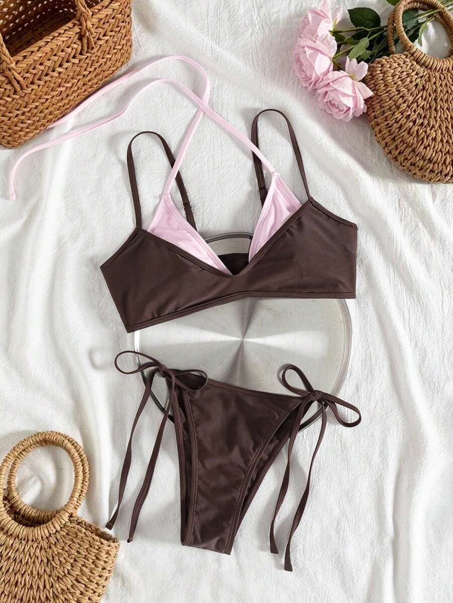 Women's color-block two-piece bikini set featuring a boho geometric pattern, tie-back halter top with removable padding, and matching tie-side bikini bottoms.