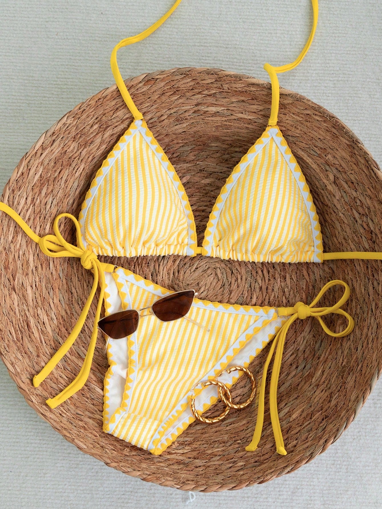 Women's triangle bikini set with contrast lace wireless bra top and ultra high waist tie side bottoms.
