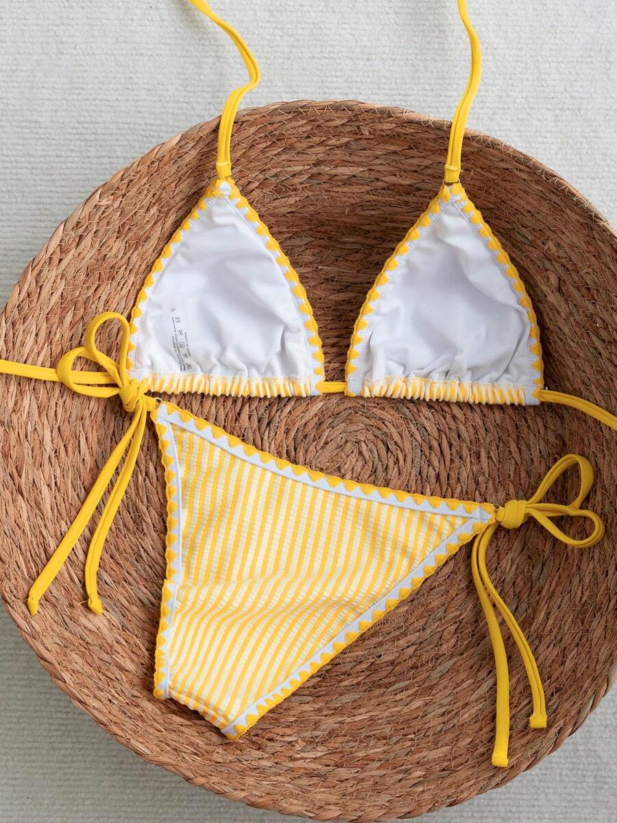 Women's triangle bikini set with contrast lace wireless bra top and ultra high waist tie side bottoms.