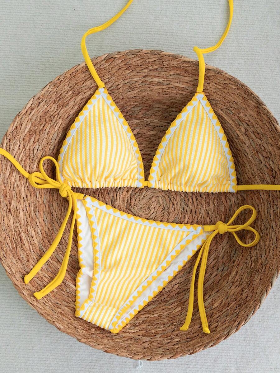 Women's triangle bikini set with contrast lace wireless bra top and ultra high waist tie side bottoms.