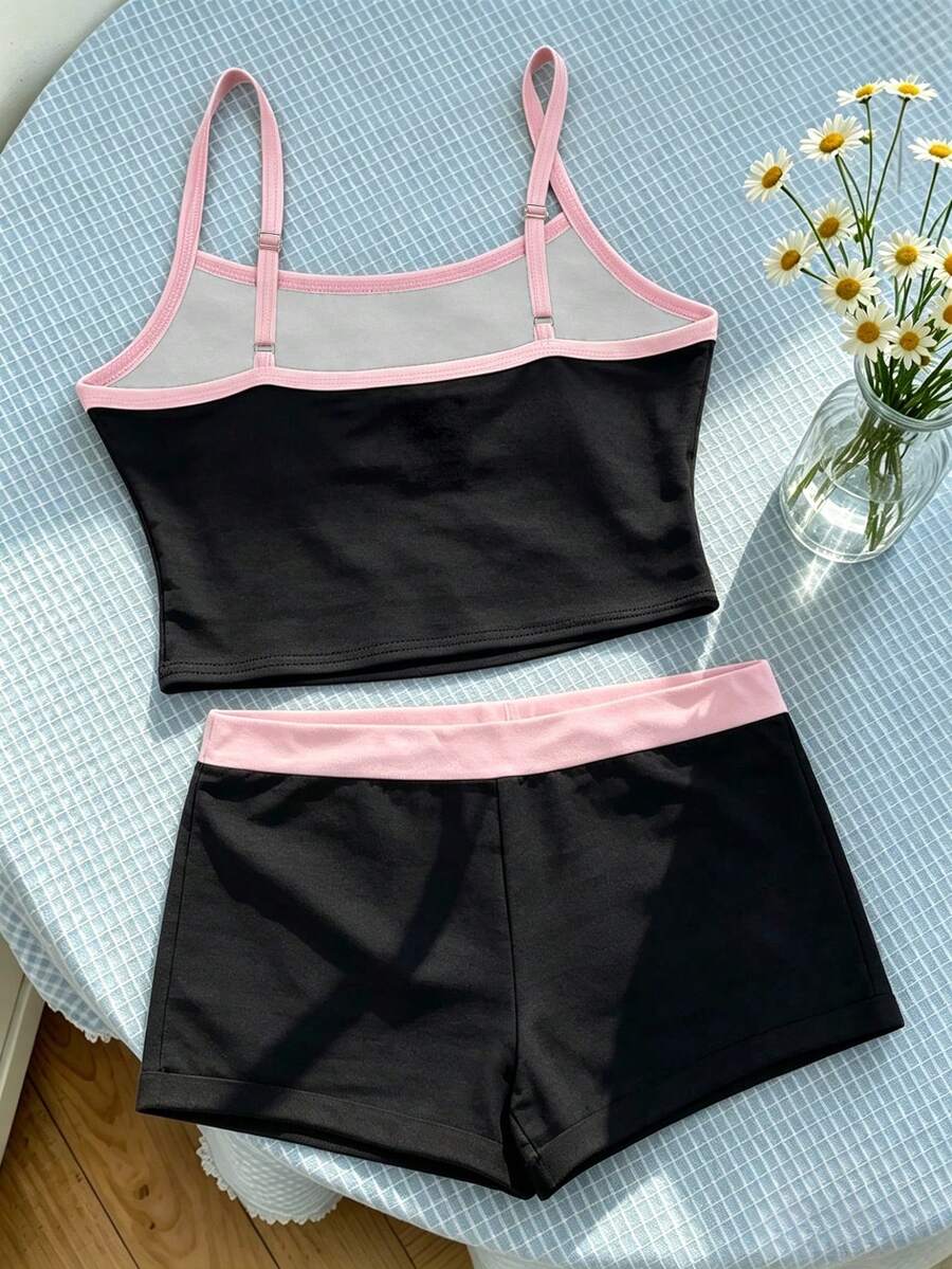 Tween girls summer 2-piece Hawaiian style outfit featuring a graphic print spaghetti strap camisole top with contrast piping and matching casual shorts.