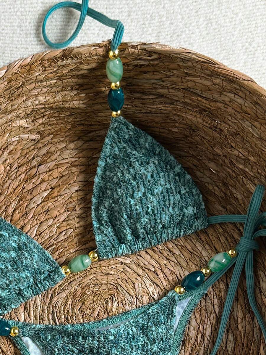 Multicolor textured beaded halter bikini set for women featuring wireless triangle cups with removable padding and ultra low waist tie side bottoms.