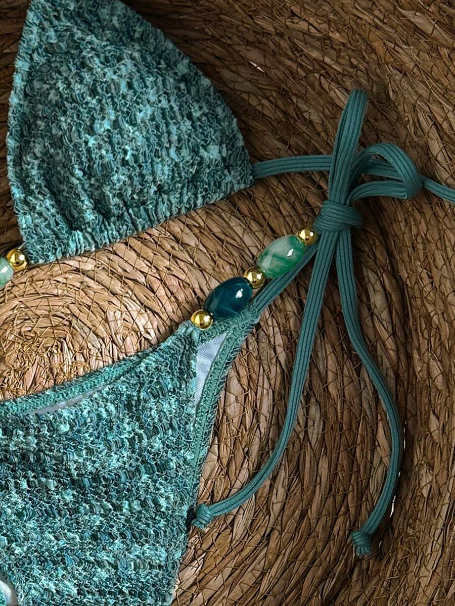 Multicolor textured beaded halter bikini set for women featuring wireless triangle cups with removable padding and ultra low waist tie side bottoms.