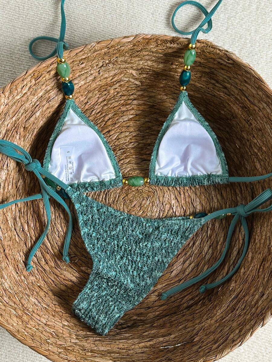 Multicolor textured beaded halter bikini set for women featuring wireless triangle cups with removable padding and ultra low waist tie side bottoms.