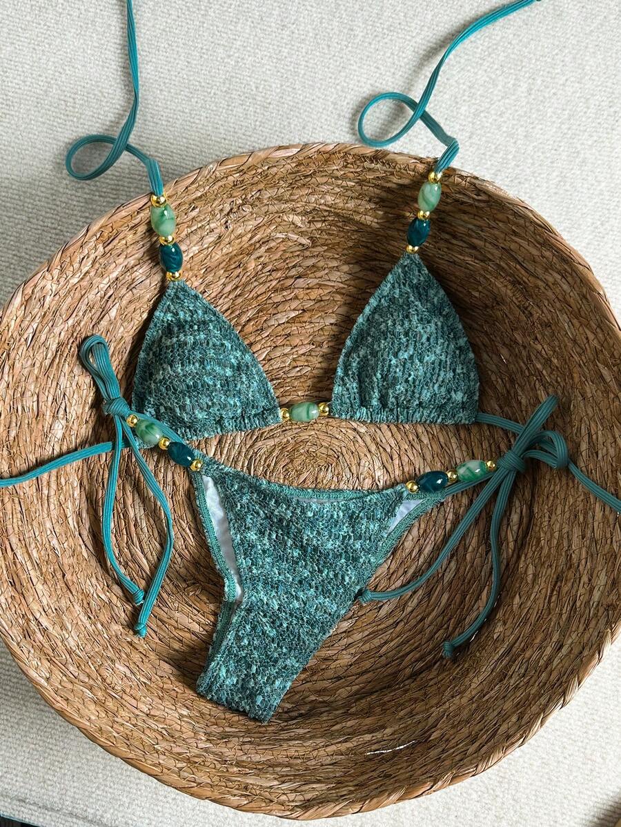 Multicolor textured beaded halter bikini set for women featuring wireless triangle cups with removable padding and ultra low waist tie side bottoms.