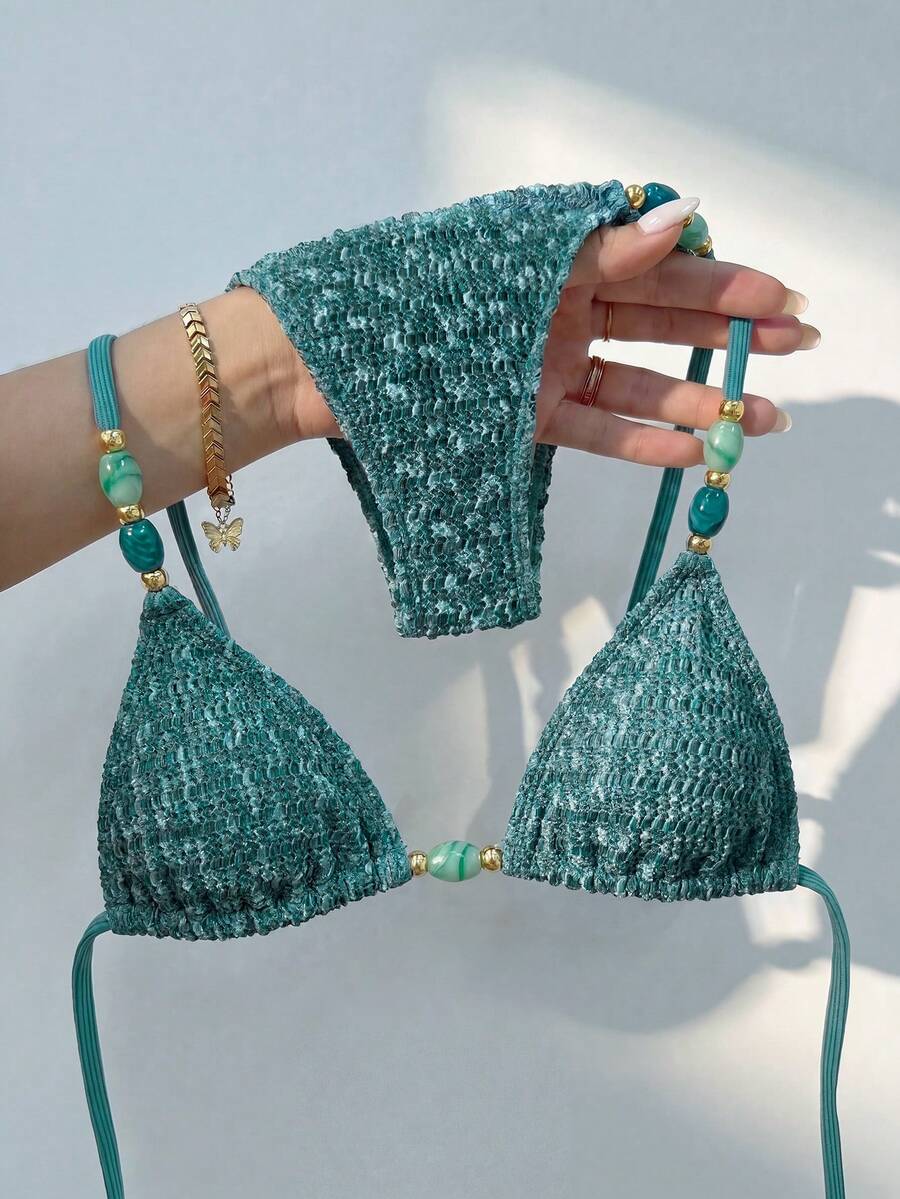 Multicolor textured beaded halter bikini set for women featuring wireless triangle cups with removable padding and ultra low waist tie side bottoms.